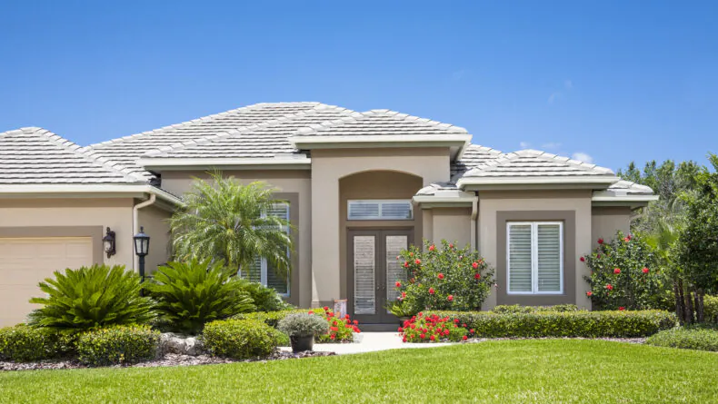 A Florida Home with a beautiful lawn and landscaping, one of a new construction projects from Beyond Builders